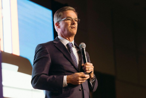 Peter Hall presenting a keynote to executives.